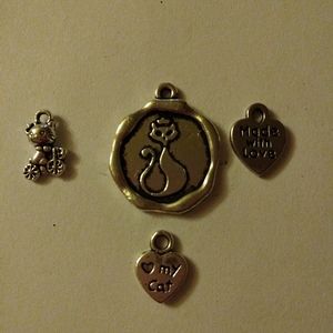 4 silvertone charms